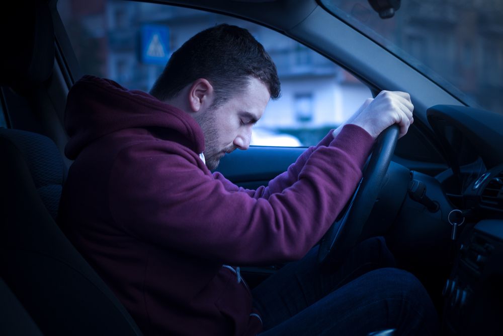 Man Sleeping On Driving Wheel 